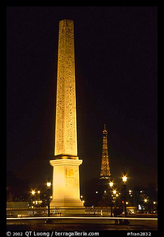 Luxor obelisk of the Concorde plaza and Eiffel Tower at night. Paris, France