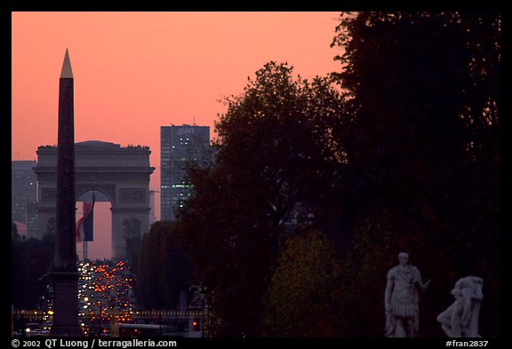 Obelisk of the Concorde and Arc de Triomphe at sunset. Paris, France (color)