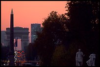 Obelisk of the Concorde and Arc de Triomphe at sunset. Paris, France (color)
