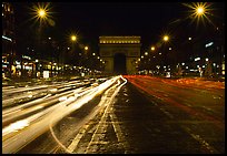 Arc de Triomphe seen from the middle of Champs Elysees at night. Paris, France ( color)