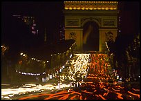 Arc de Triomphe and Champs Elysees at night with car light trails. Paris, France (color)