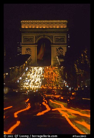 Arc de Triomphe and lights of cars on Champs Elysees. Paris, France