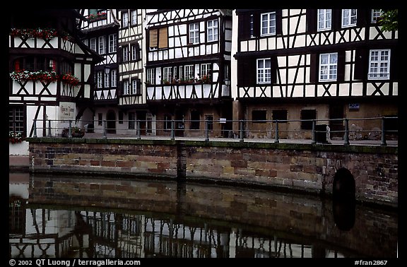 Half-timbered houses reflected in canal. Strasbourg, Alsace, France