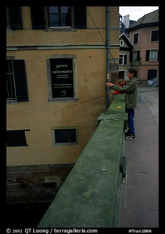 Fishing in a canal. Strasbourg, Alsace, France