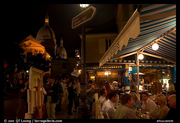 Outdoor dining at night on the Place du Tertre, Montmartre. Paris, France (color)