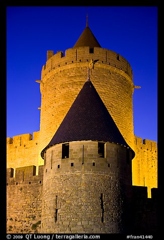 Towers with witch hat roofs by night. Carcassonne, France