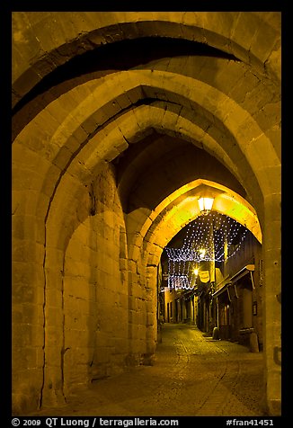 Rue Cros Mayerevielle through medieval Porte Narbornaise. Carcassonne, France