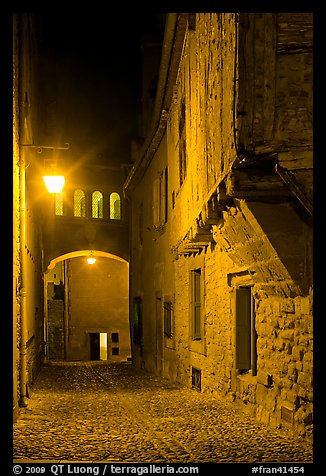 Cobblestone street by night inside medieval city. Carcassonne, France (color)
