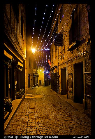 Medieval street by night with Christmas decorations and. Carcassonne, France