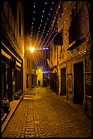 Medieval street by night with Christmas decorations and. Carcassonne, France
