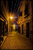 Medieval street by night with Christmas decorations and. Carcassonne, France (color)