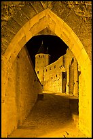 Ramparts and tower framed by gate at night. Carcassonne, France ( color)