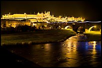 Fortified city and Pont Vieux crossing the Aude River by night. Carcassonne, France
