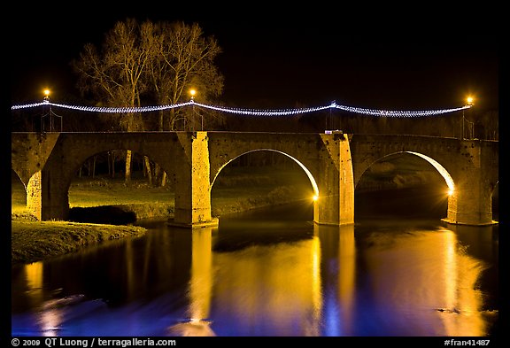 Pont Vieux illuminated by night with Christmas lights. Carcassonne, France