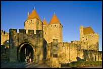 Main entrance of medieval city  with child and adult walking in. Carcassonne, France ( color)