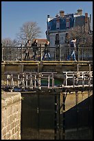 Pedestrians walking on brige above Canal du Midi. Carcassonne, France