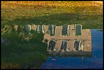 House reflections with fallen leaves, Canal du Midi. Carcassonne, France ( color)