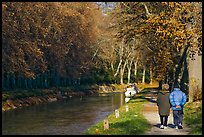 Couple walking along Canal du Midi. Carcassonne, France ( color)