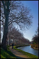 Cyclist along Canal du Midi. Carcassonne, France (color)