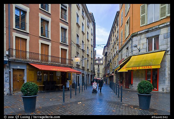 Pedestrian street with couple pushing stroller. Grenoble, France (color)