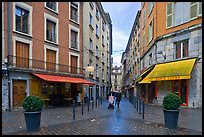 Pedestrian street with couple pushing stroller. Grenoble, France ( color)