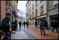Accordeon musician on commercial pedestrian street. Grenoble, France (color)