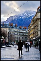 Downtown street and snowy mountains of the Belledone Range. Grenoble, France ( color)