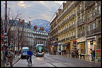 Bicyclist and tramway next to Victor Hugo place. Grenoble, France (color)