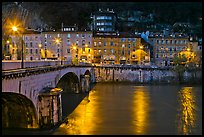 Isere River, Citadelle stone bridge and old houses at dusk. Grenoble, France (color)