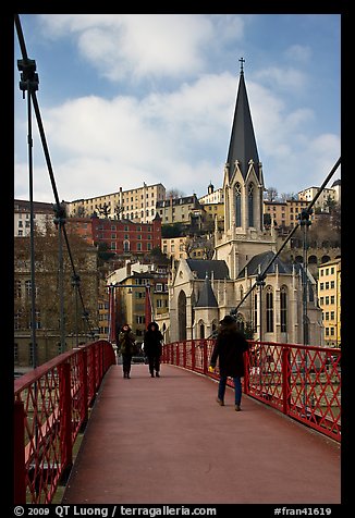 Walking across the passerelle Saint-Georges. Lyon, France (color)