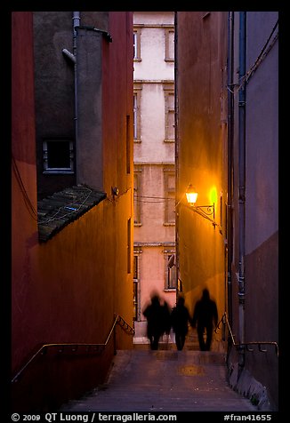 Silhouettes in staircase on Fourviere Hill at dusk. Lyon, France