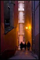 Silhouettes in staircase on Fourviere Hill at dusk. Lyon, France