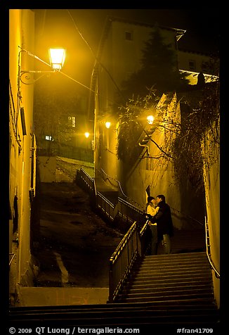 Couple embrassing romantically on stairs to Fourviere Hill. Lyon, France (color)