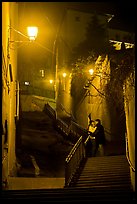 Couple embrassing romantically on stairs to Fourviere Hill. Lyon, France