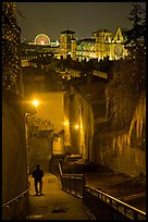 Man walking down stairs from Fourviere Hill, with St-Jean Cathedral below. Lyon, France