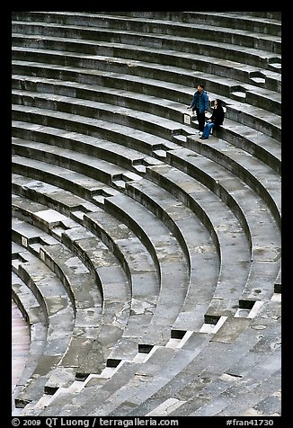 Couple standing in amphitheater, Orange. Provence, France (color)