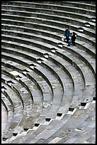 Couple standing in amphitheater, Orange. Provence, France (color)