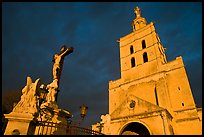 Crucifix and romanesque tower of Notre-Dame-des-Doms Cathedral. Avignon, Provence, France (color)