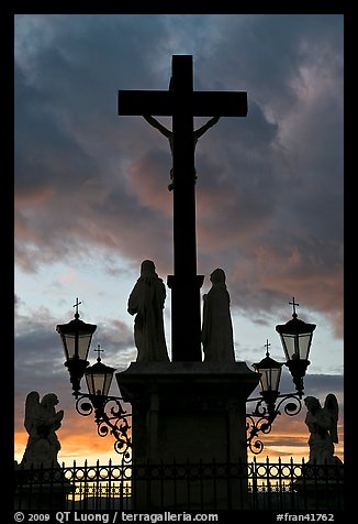 Cross and statues with sunset clouds. Avignon, Provence, France (color)