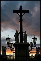 Cross and statues with sunset clouds. Avignon, Provence, France (color)