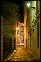 Narrow street leading to Palais des Papes at night. Avignon, Provence, France (color)