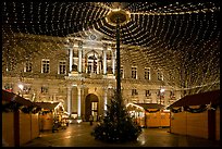 Christmas fair and City hall at night. Avignon, Provence, France