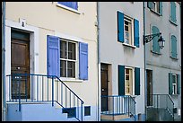 Facade of townhouses with colorful shutters. Arles, Provence, France