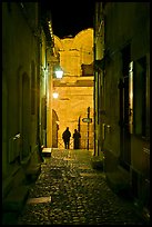 Narrow cobblestone passageway at night next to arena. Arles, Provence, France ( color)