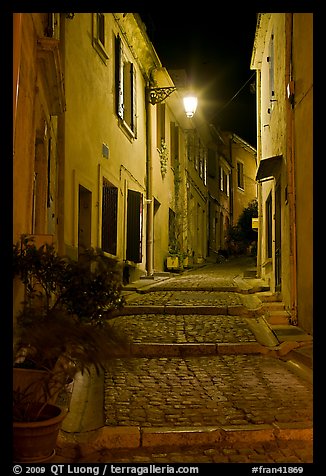 Cobblestone passageway with stepts at night. Arles, Provence, France (color)