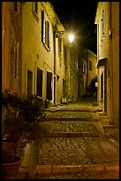 Cobblestone passageway with stepts at night. Arles, Provence, France (color)