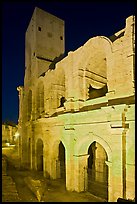Arenes Roman amphitheater with defensive tower at night. Arles, Provence, France (color)