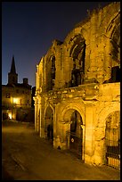 Roman arenes and church at night. Arles, Provence, France