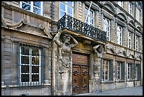 Facade with sculptures supporting a balcony. Aix-en-Provence, France