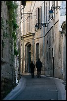 Couple walking in old street. Arles, Provence, France ( color)